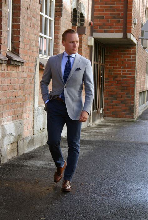 grey jacket navy pants.